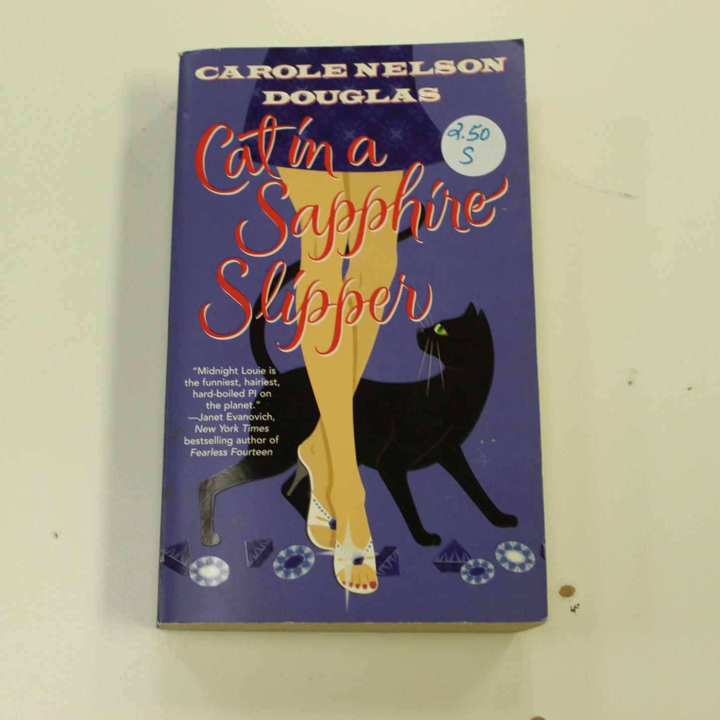 CAT IN A SAPPHIRE SLIPPER