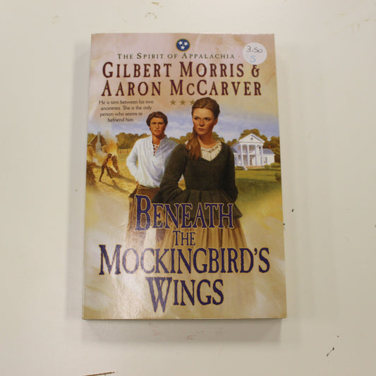 BENEATH THE MOCKINGBIRD'S WINGS